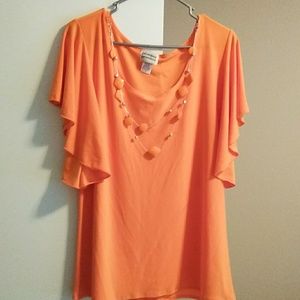 Orange top with necklace made onto it